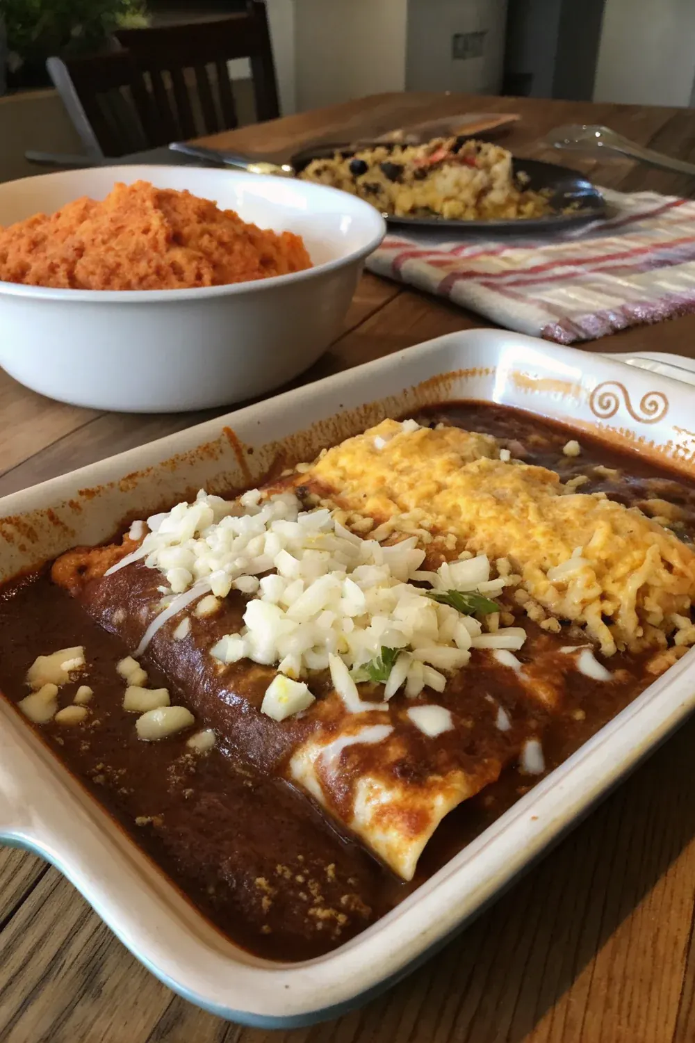Tex-Mex beef and cheese enchiladas with chili gravy, yellow cheese, raw onion topping, save for a Texas family dinner