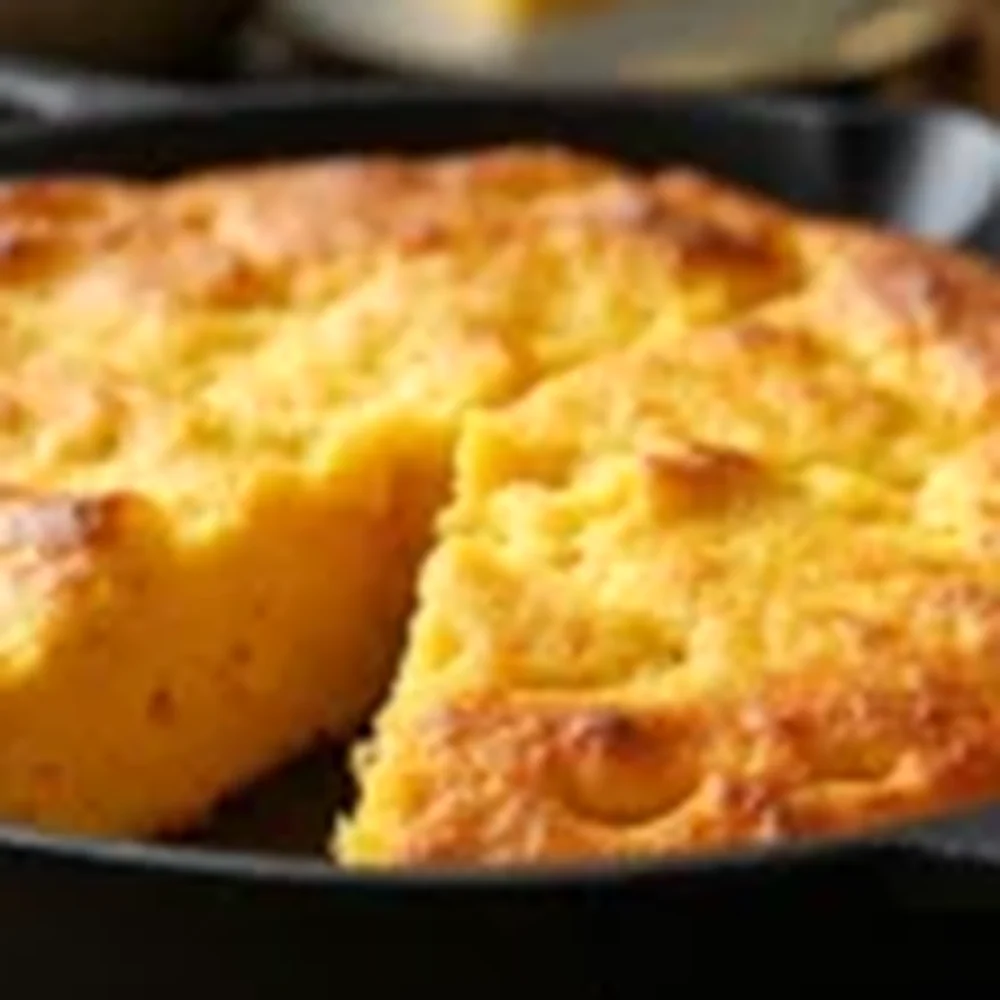 Cast Iron Skillet Cornbread plated for a Texas family table, overhead view